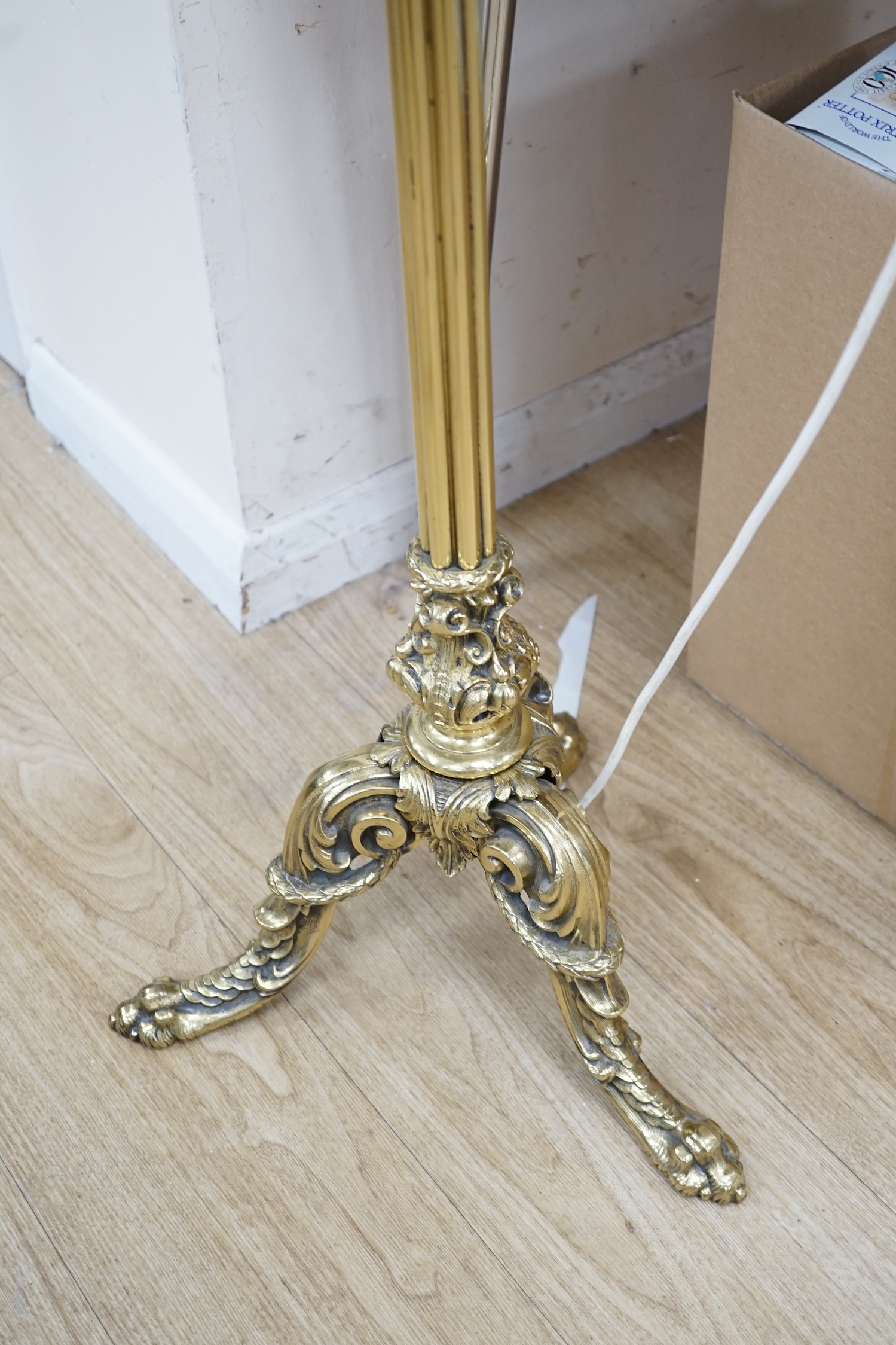 A modern brass standard lamp on tripod feet, 150cm. Condition - fair to good. Not tested as working